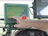 image of a farmer in their tractor taking a look at technology and a red video play button