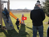 Image of a farmers family playing and enjoing themselves